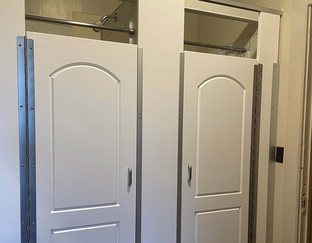 Scranton Products DeKoven Center Case Study Cover Row of Hiny Hider shower doors that are closed